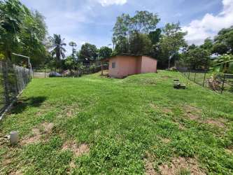 Wide open backyard with storage shed fenced in La Chorrera Panama