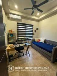 Fully equipped modern kitchen with granite countertops, island, stainless steel appliances at Boquete Canyon Village home Panama