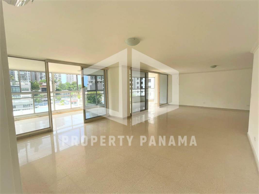 Open plan living dining area with large sliding doors to balcony PH Savoy Panama