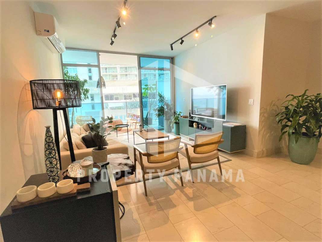 Modern living room with floor-to-ceiling windows and ocean view Punta Pacífica Panama