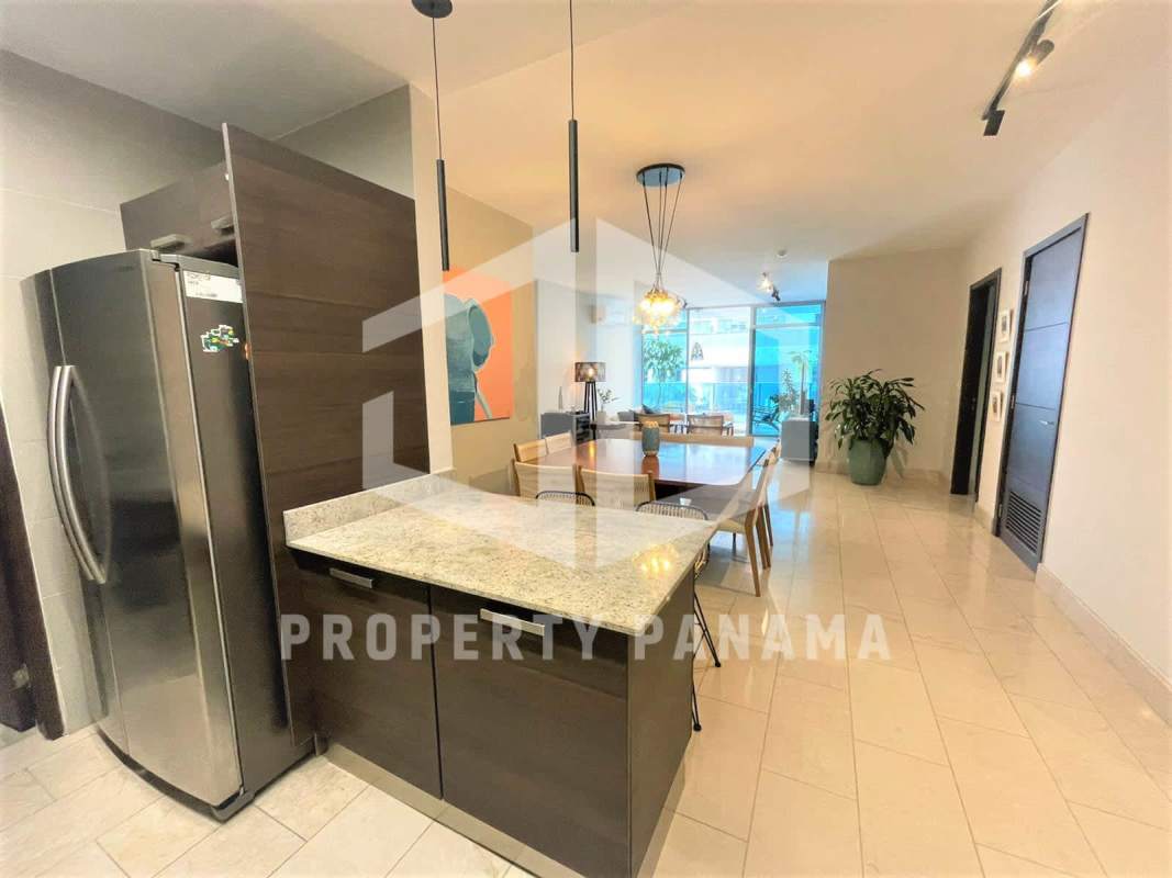 Dining area with panoramic ocean view windows in PH Grand Tower Punta Pacífica Panama