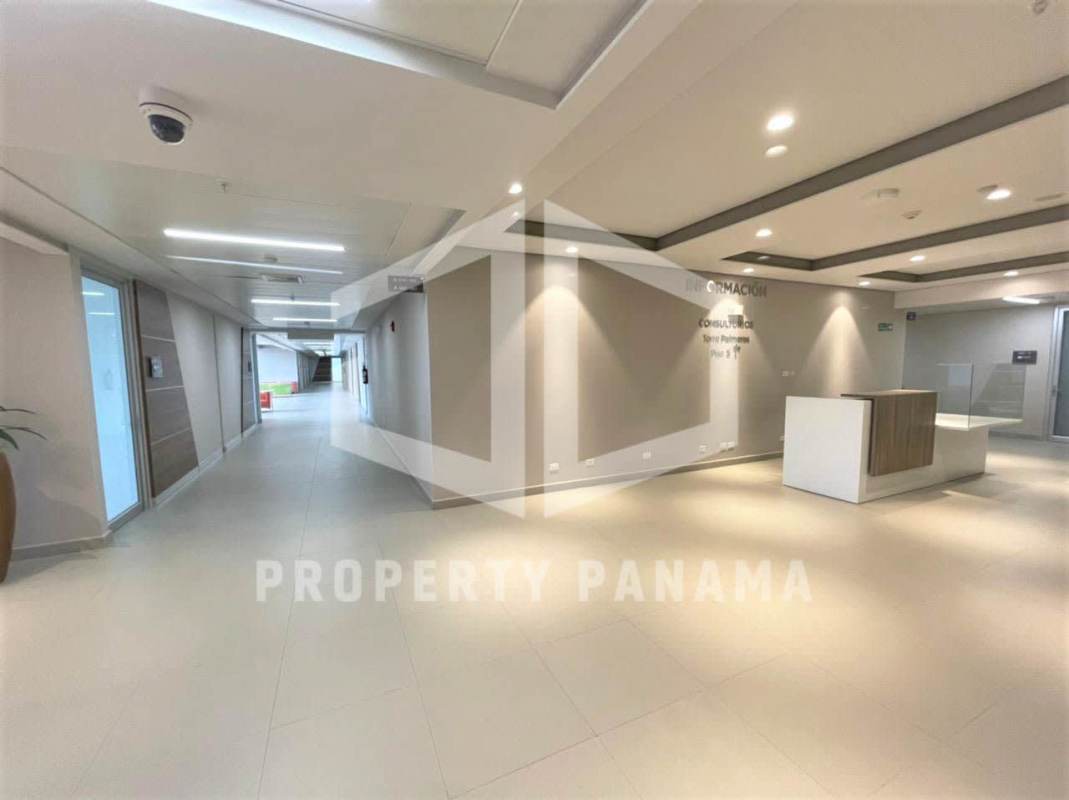 Modern reception lobby with desk, signage and recessed lighting in Town Center Costa del Este Panama