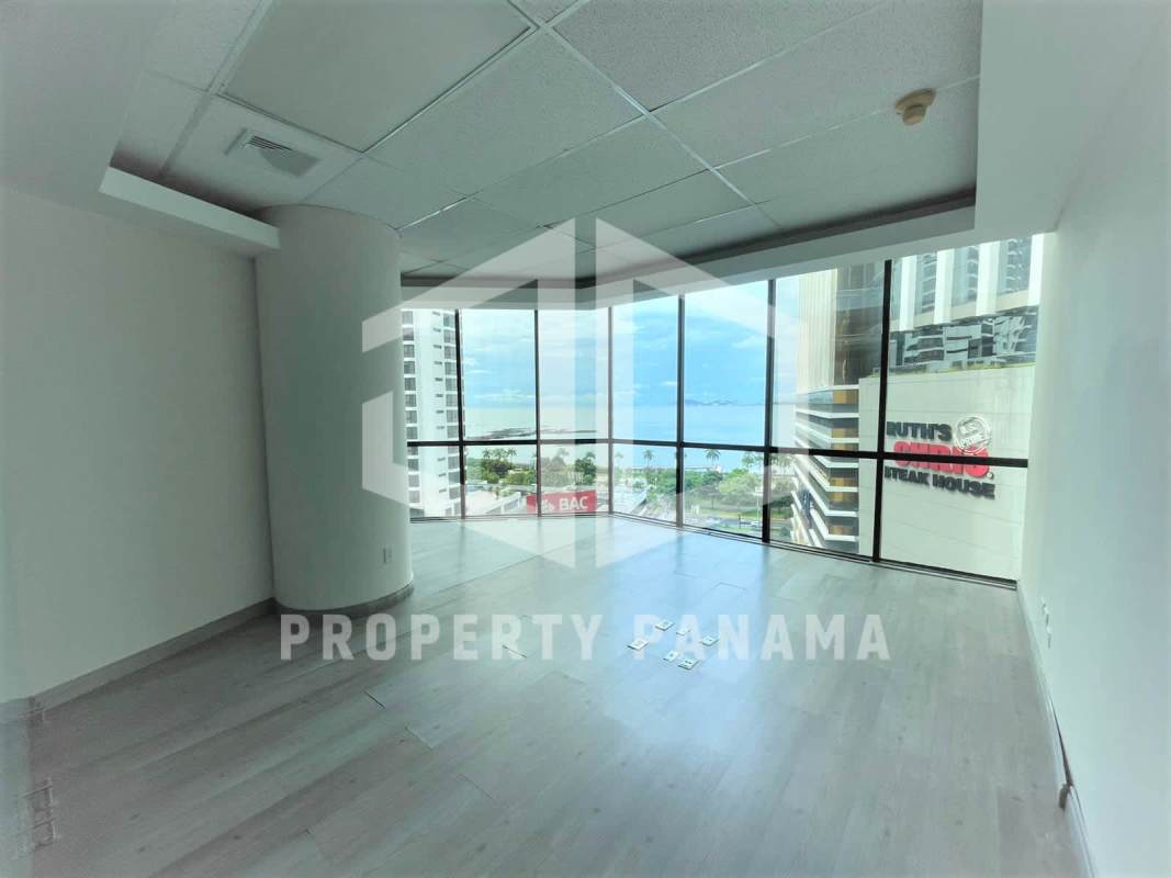 Modern corporate office space with panoramic windows and laminate floors in Torre Banco General Panama