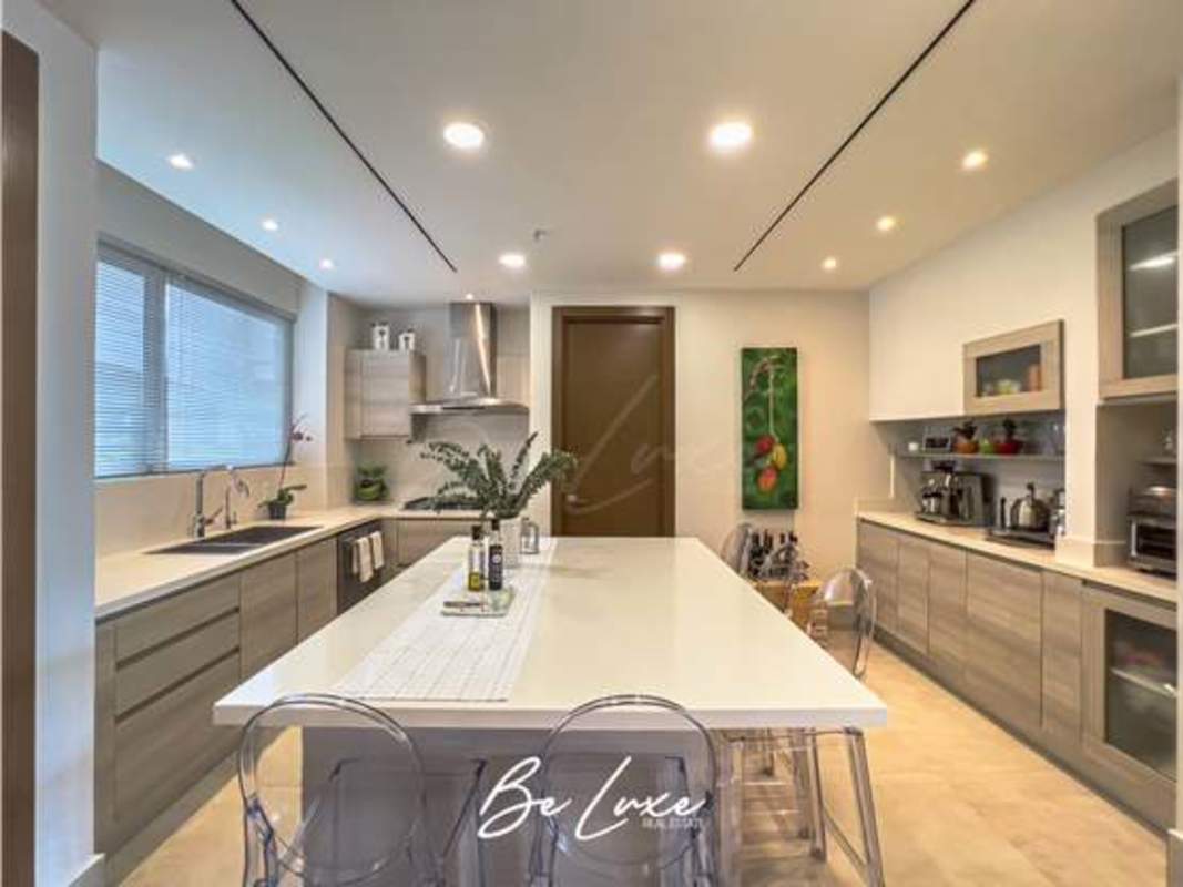Modern bathroom with double vanity, glass shower, premium finishes at The Reserve penthouse Santa Maria