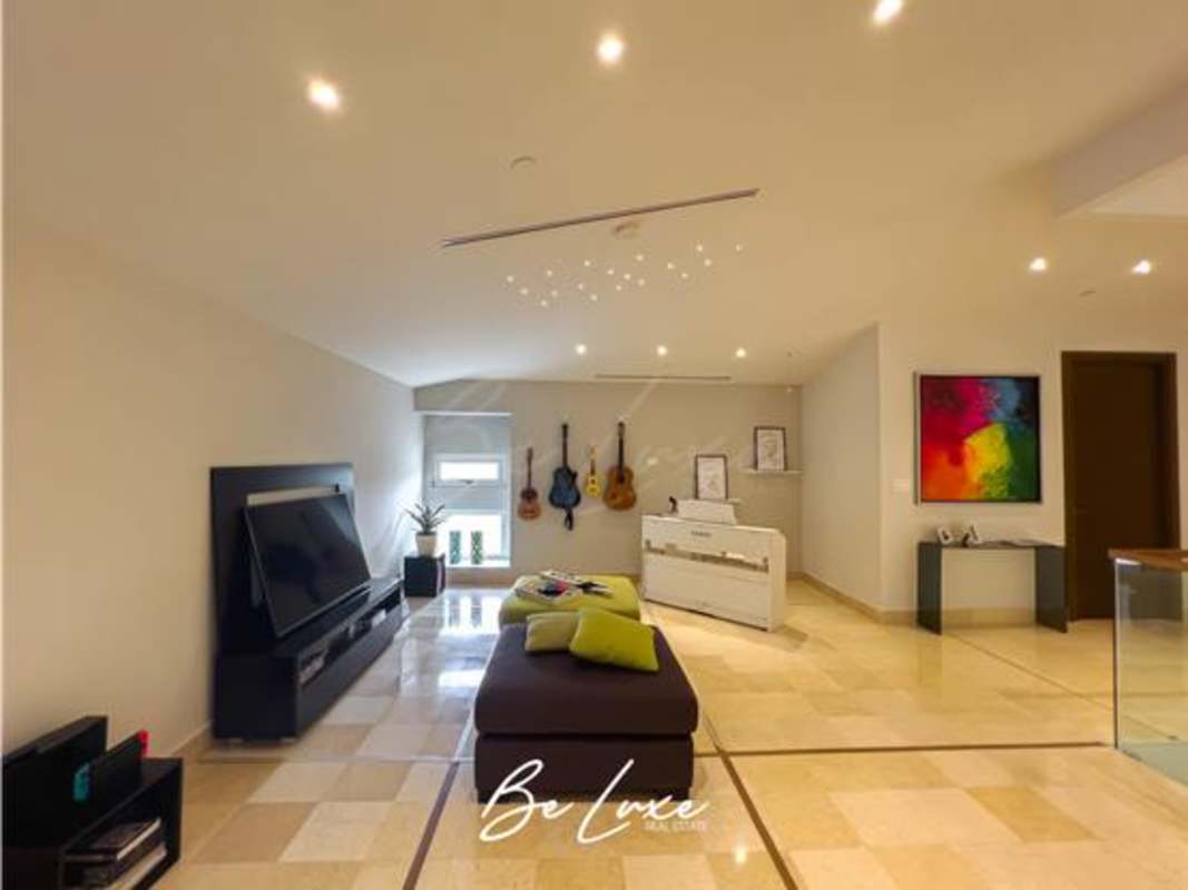 Resort-style lagoon pool and sandy beach area inside The Reserve Santa Maria Panama City