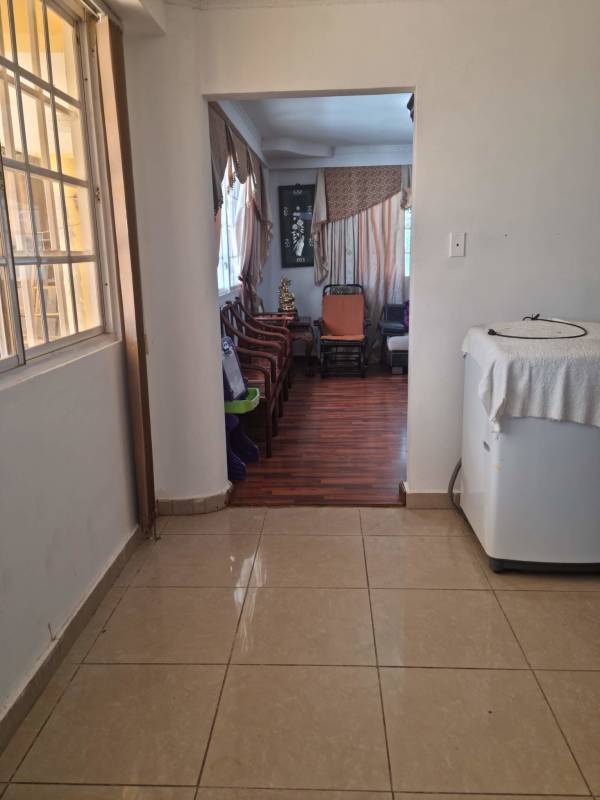 Large bedroom with decorative wall, wooden furniture in house for sale Brisas del Golf Panama