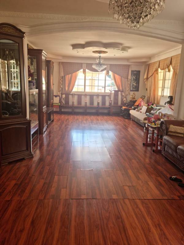 Covered balcony with columns offering mountain and city views from house Brisas del Golf Panama