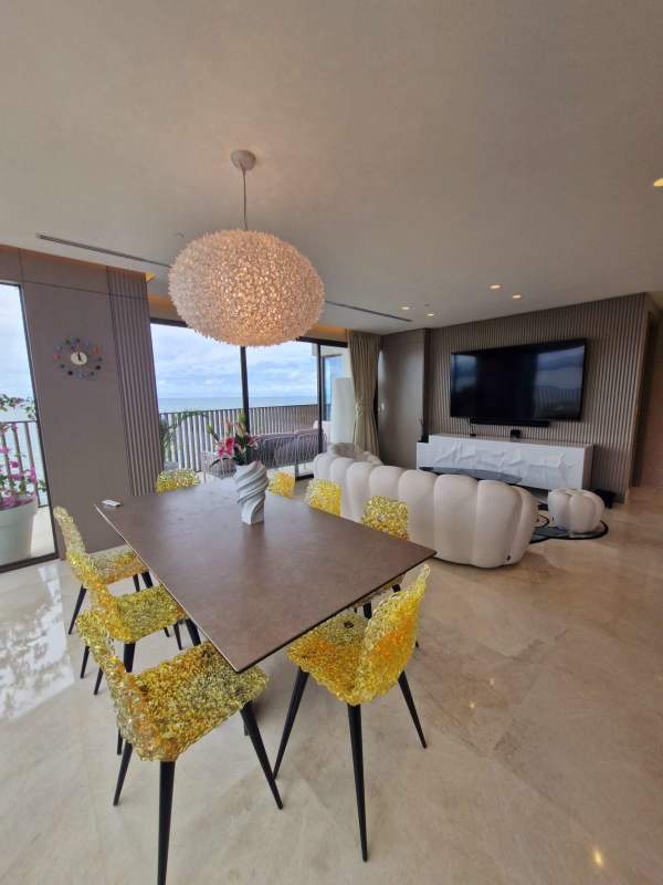 Modern open kitchen with marble island, dining area, ceiling lighting at PH Seascape Panama