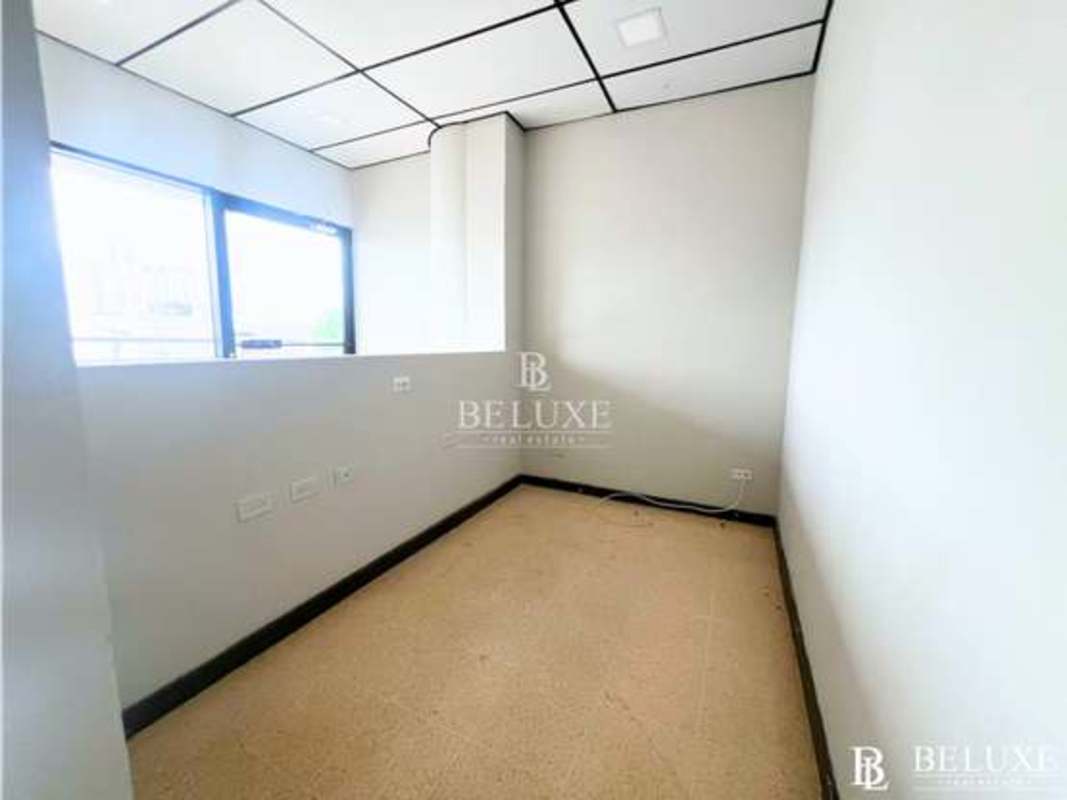 Simple tiled bathroom with pedestal sink, toilet and mirror in PH El Dorado Business Center Panama
