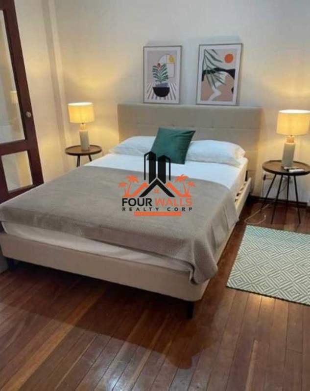 Bedroom loft with glass railing, wood flooring, modern furnishings Casco Viejo Panama