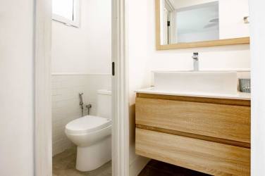Guest bathroom with glass-enclosed shower and modern finishes at Blue Venao Condo Playa Venao