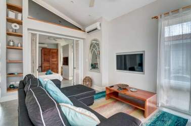 Modern kitchen with island, pendant lights, double door fridge in Blue Venao villa Playa Venao Panama