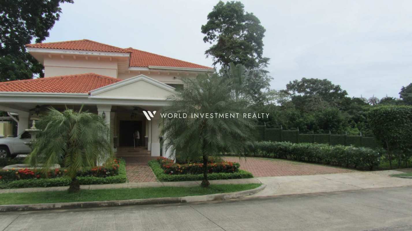 Covered terrace with ceiling fan and BBQ space overlooking garden at luxury house in Camino de Cruces Panama