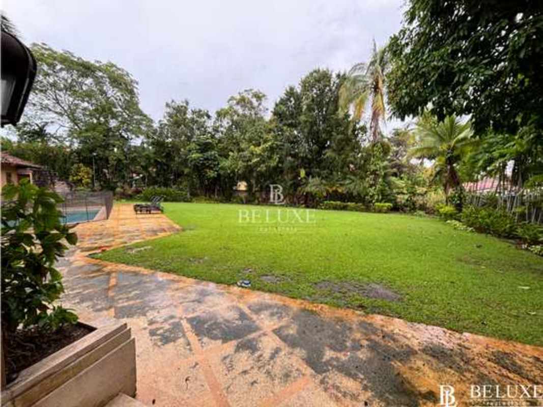 Grand entrance luxury estate Altos del Golf with palm trees and elegant gate Panama