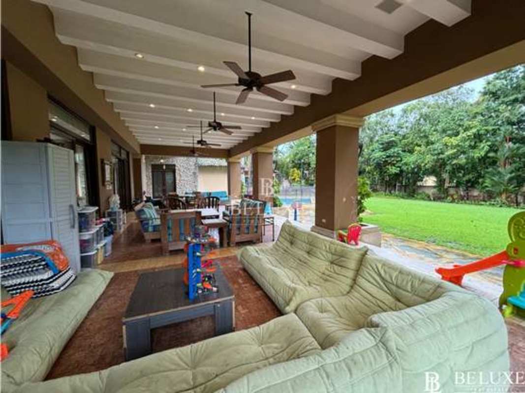 Spacious traditional living room with chandeliers, marble floors in luxury estate Panama