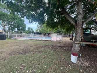 Large fenced commercial yard with trees and pool, potential for retail or warehouse in Gorgona Panama