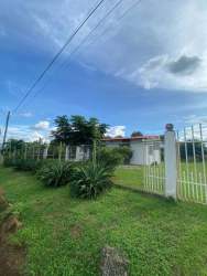 Simple minimalist kitchen with windows for natural light and dining space Los Boquerones Veraguas