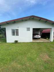 Spacious backyard with fence, garden area and trees in residential Los Boquerones Veraguas rental home