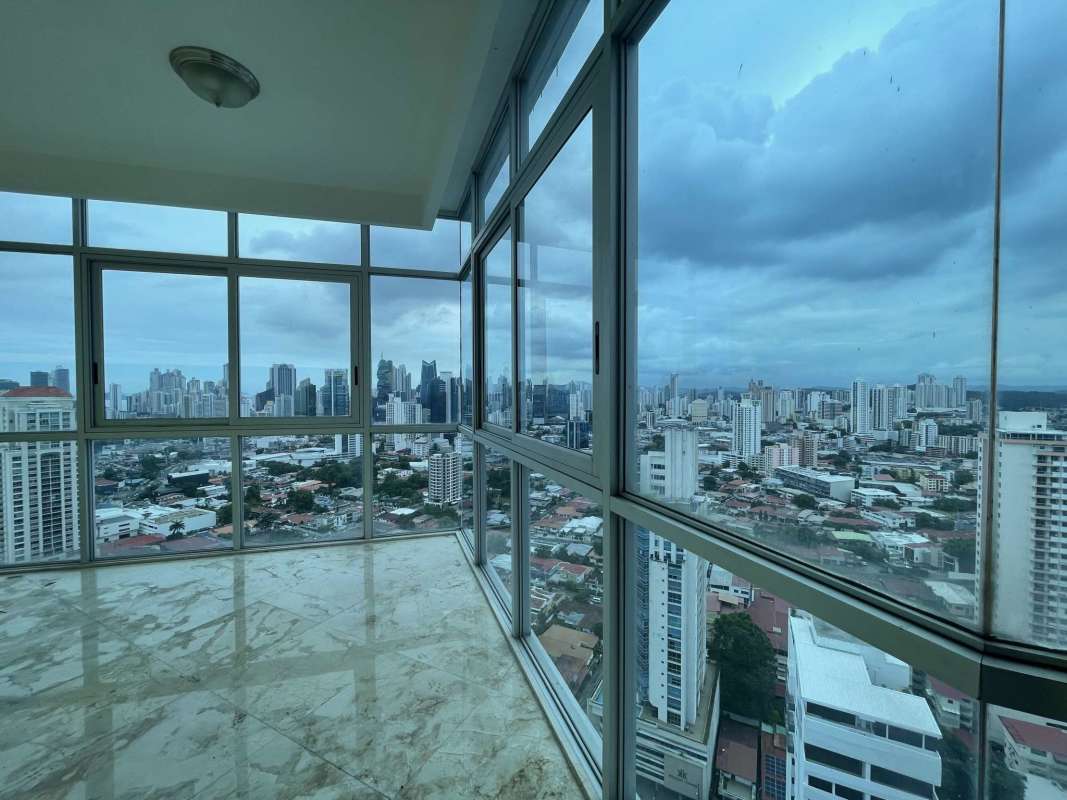 Interior penthouse corner space with floor-to-ceiling corner windows panoramic view PH Keops Tower Panama