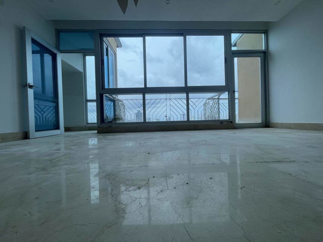 Bright modern living room with balcony floor-to-ceiling windows PH Keops San Francisco Panama