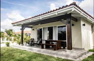 Covered patio with furniture garden views beach villa Panama