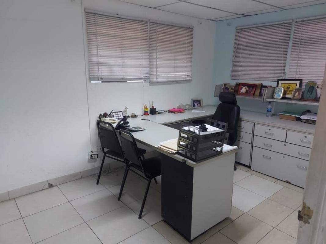Small utility kitchen with yellow tiled counters at commercial property Río Abajo Panama