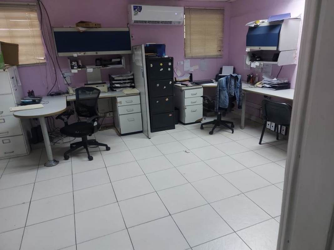 Office room with tile floor, desks, storage cabinets and AC in commercial warehouse Monte Oscuro Panama