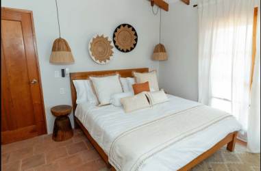 Infinity edge pool overlooking ocean with loungers at Casa Serena Los Destiladeros Pedasí Panama