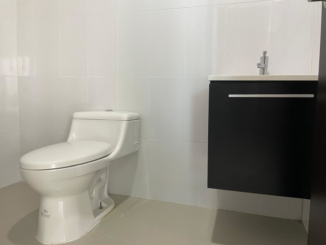 Minimalist bathroom with vanity sink and modern tile at PH Office One Obarrio Panama City
