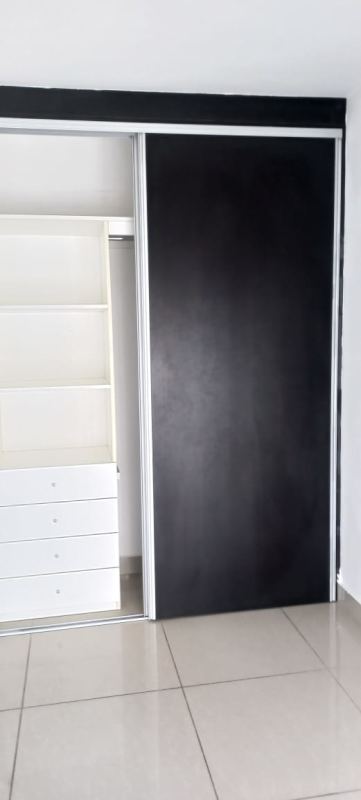 Built-in closet with sliding doors shelving and drawers PH Coral Towers Carrasquilla Panama City