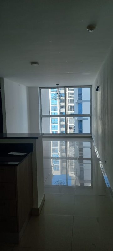 Modern living room with large floor-to-ceiling windows and tile floors in PH Coral Towers Panama City