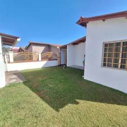 Covered balcony with metal railing and grassy yard Vacamonte Panama