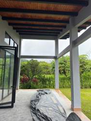 Large covered terrace overlooking private landscaped garden in El Valle Panama