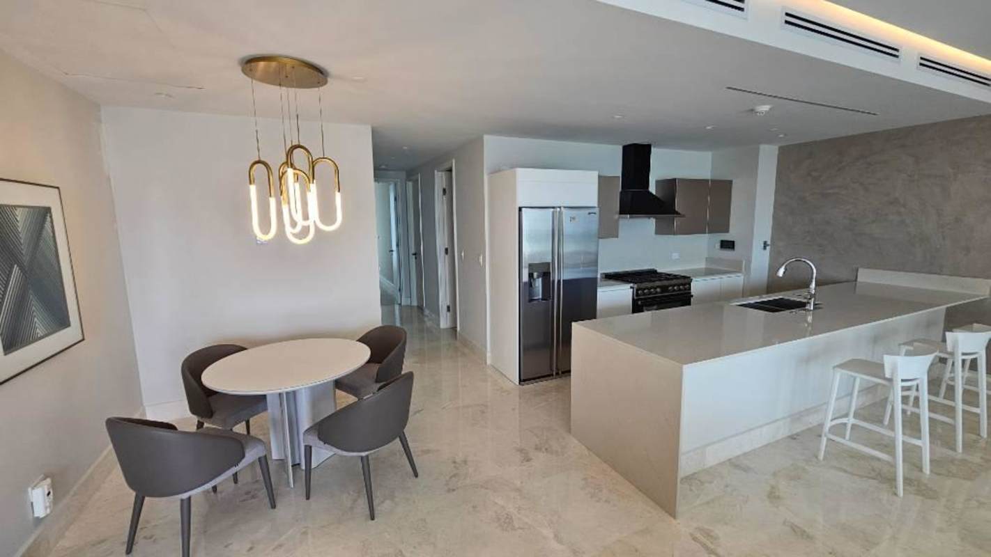 Spacious living area with large windows and designer furniture Ocean Reef Islands Panama City