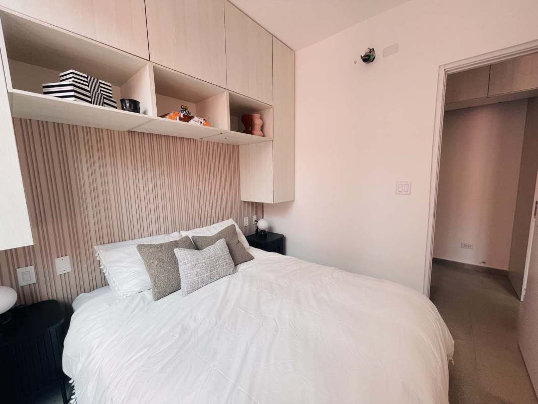 Minimalist bedroom design with balcony overhead cabinets Casa Korsi Panama