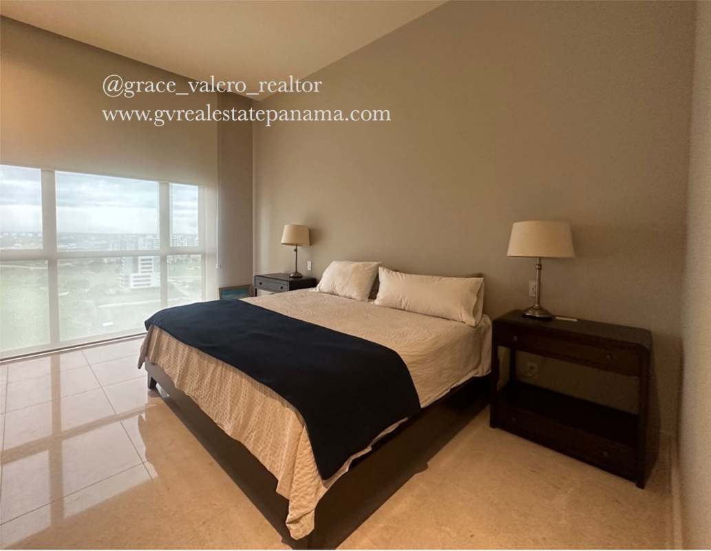 Contemporary marble-enriched bathroom with glass shower, vanity and mirror PH The Court Panama
