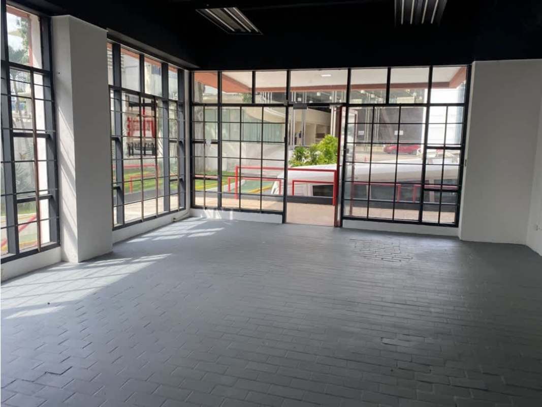 Interior view of commercial space for sale with large display windows and ceramic flooring near Hotel El Panama