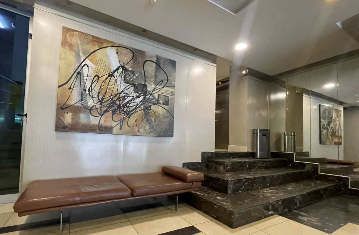 Kitchen with granite countertops, stainless steel appliances, dark wood cabinets in PH Belle View Bella Vista Panama