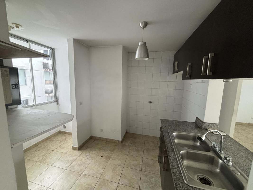 Spacious bedroom with tile floor and large window Cosmopolitan Tower Panama