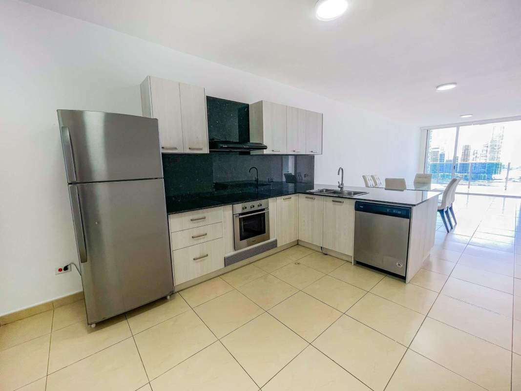Modern walk-in closet with wood built-in shelving and hanging space in PH White Tower Panama