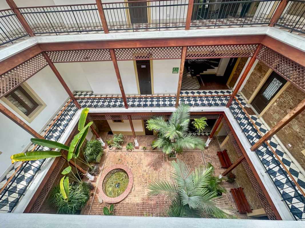 Interior courtyard with central pond, balconies, old city colonial residence Casco Viejo Panama