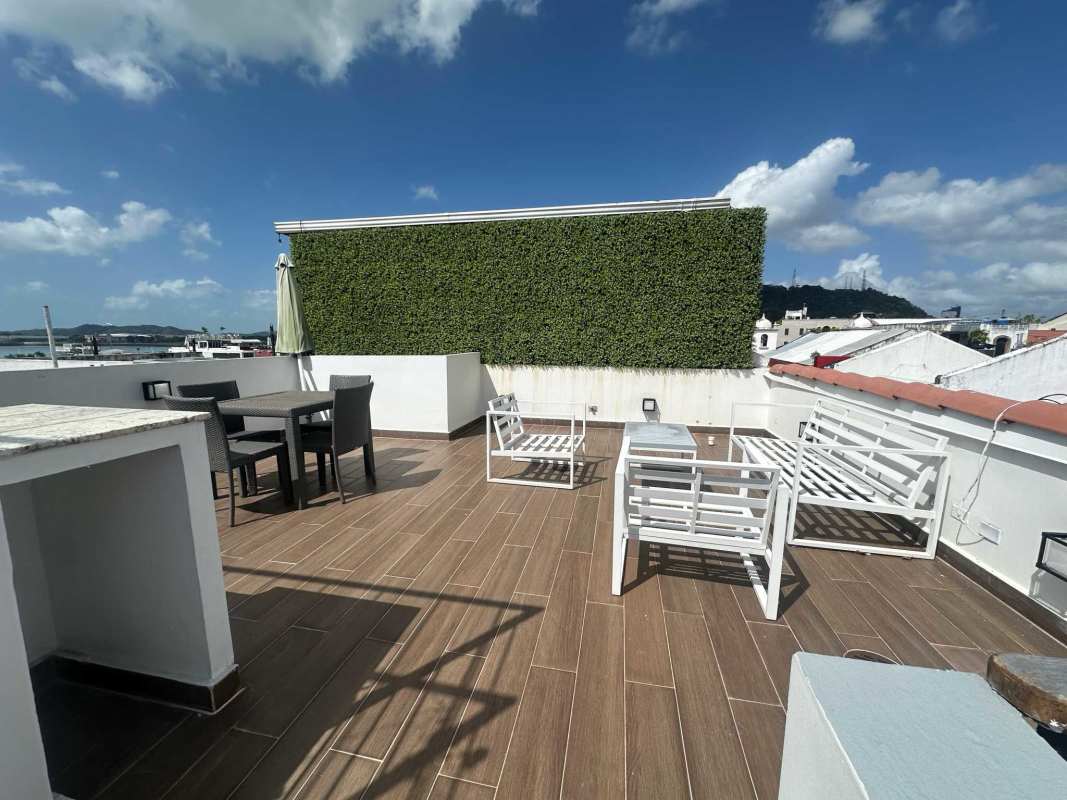 Modern rooftop garden terrace with dining city view Casco Viejo apartment Panama