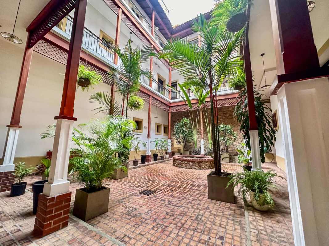 Colonial courtyard with balconies lush plants Casco Viejo historic apartment Panama