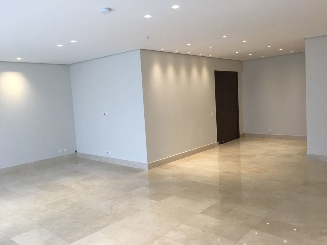 Luxury living room with marble flooring and panoramic windows overlooking golf in PH La Vista Santa María