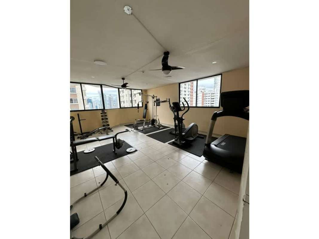 Panoramic view of rooftop terrace pool area with city skyline in Panama