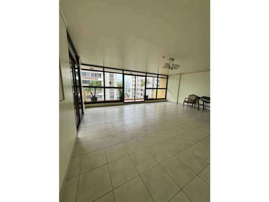 Traditional dining area with tiled floors, chandelier, tray ceiling in Panama City apartment