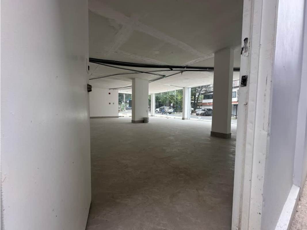 Unfinished interior of new commercial space with floor-to-ceiling windows and concrete floors in San Francisco Business Plaza Panama