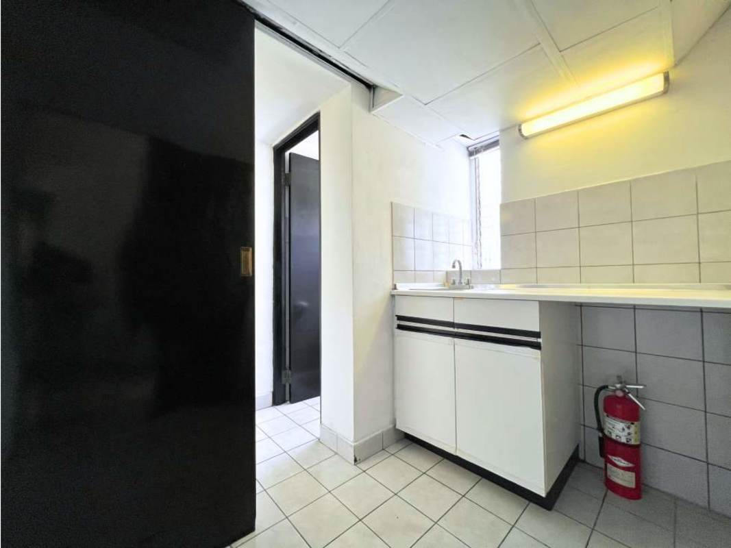 Small utility kitchenette with cabinetry, tiled backsplash, fluorescent lighting at PH Advanced Panama