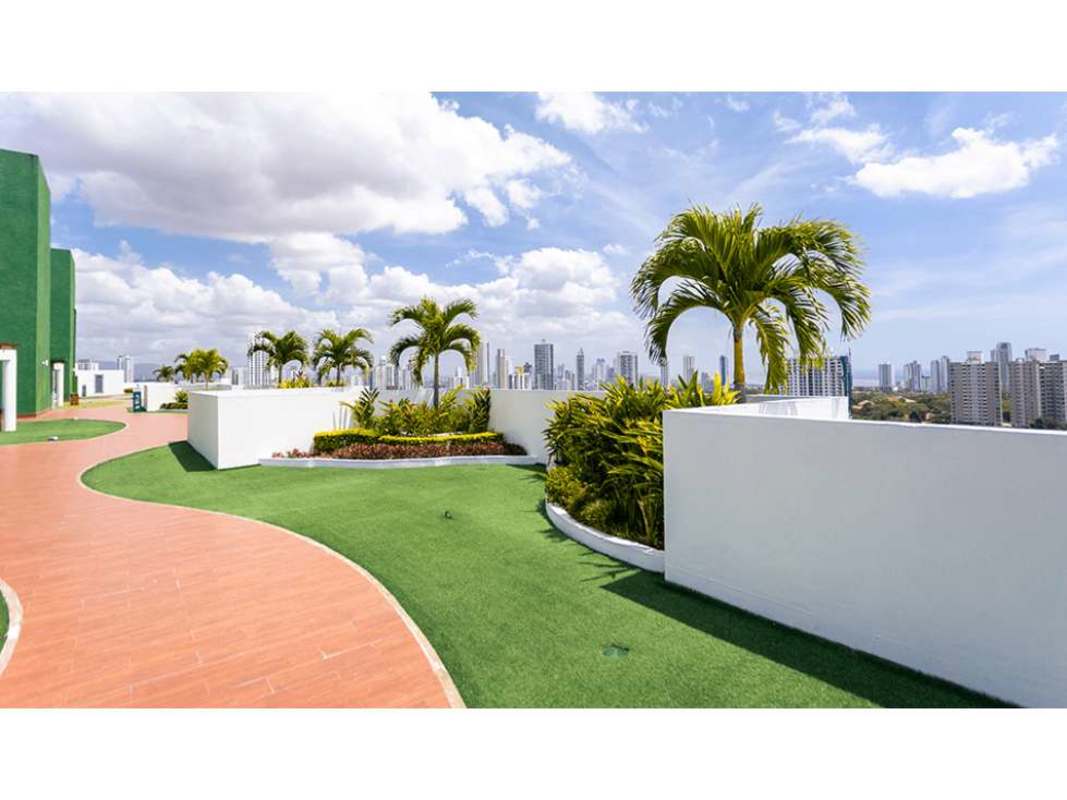 Fully equipped gym with cardio machines, weights, large windows city skyline view in PH Midpark