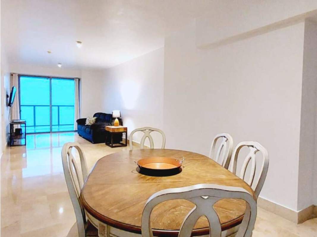 Spacious living and dining room with marble floors and ocean-view balcony at PH Yoo Panama